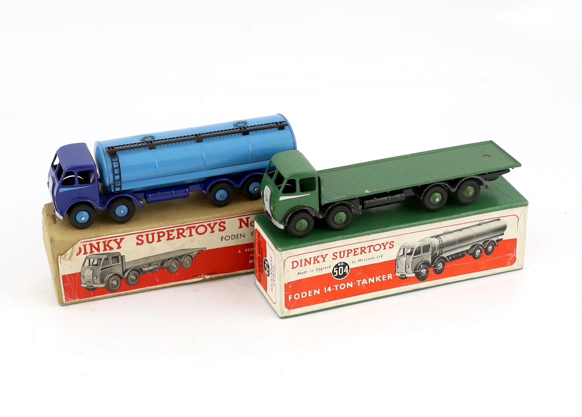 Two boxed Dinky Supertoys first type Fodens; a 14-ton tanker (504), with dark blue cab and chassis, and pale blue tank and wheels and a Flat Truck (502), in green with silver flash, in correct colour-marked box